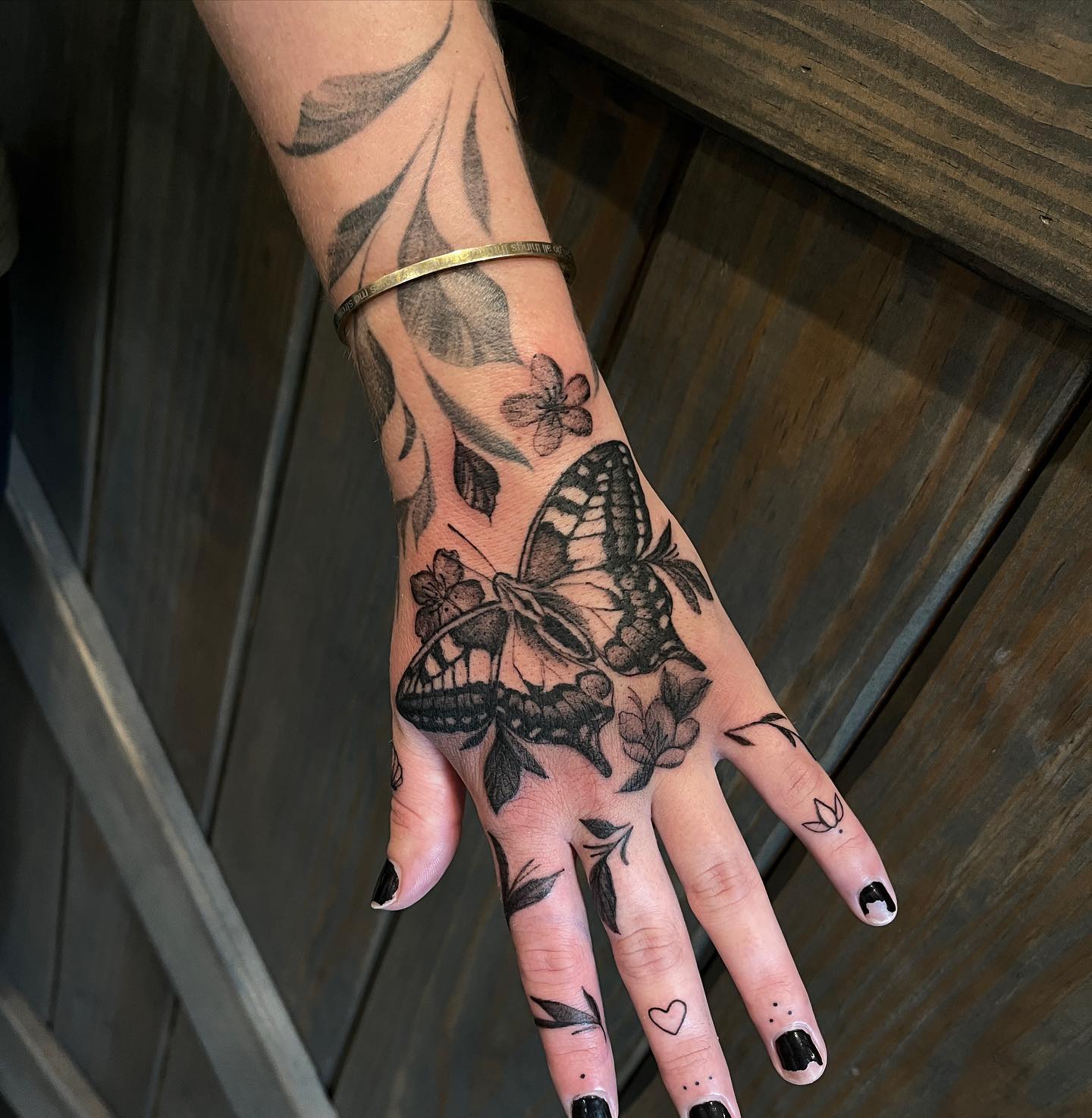 butterfly tattoo on hand for girl