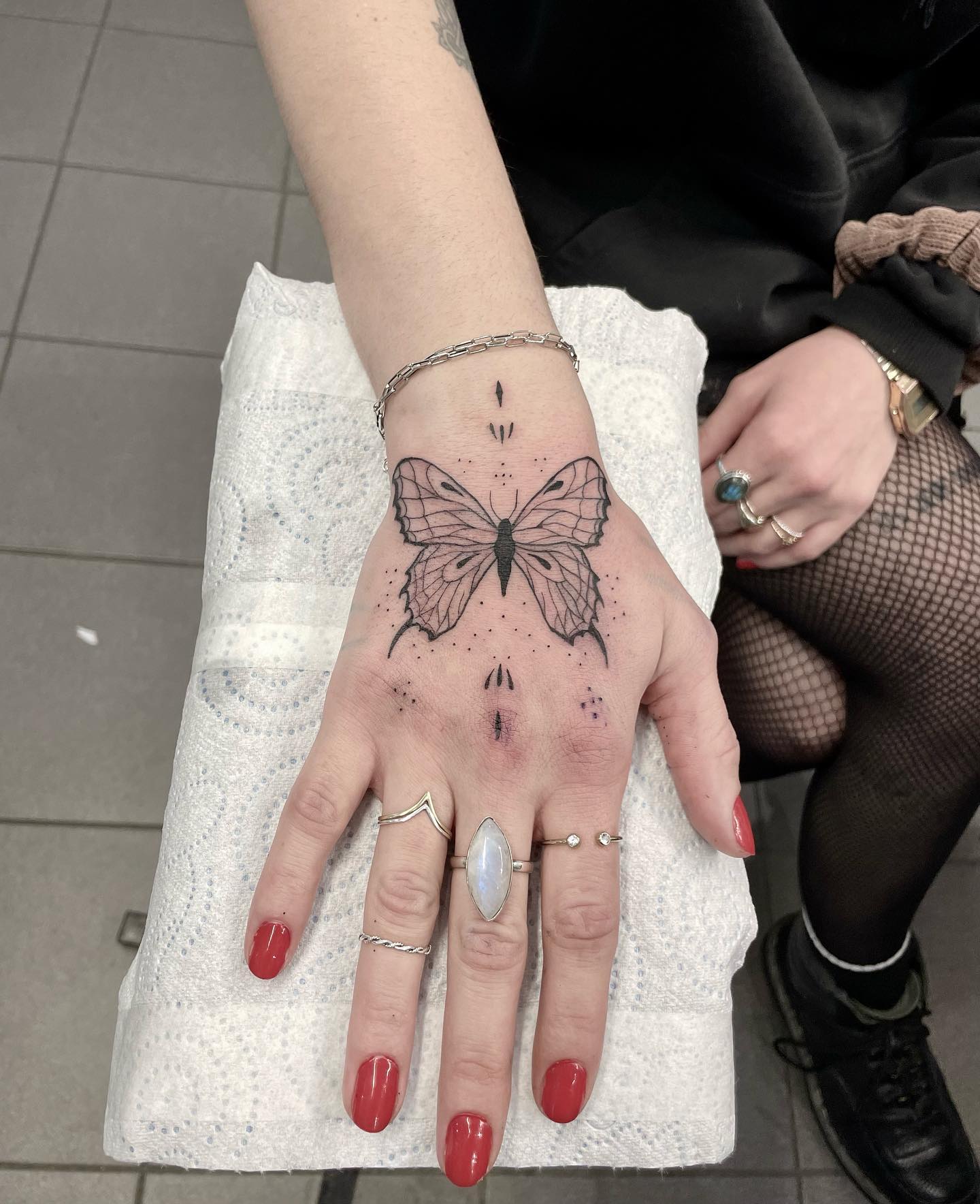 Colorful butterfly tattoo on the hand